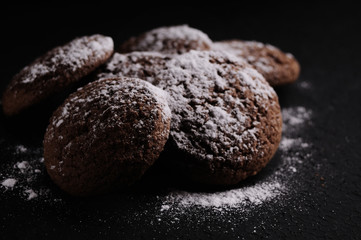 oatmeal cookies on a black table in castor sugar