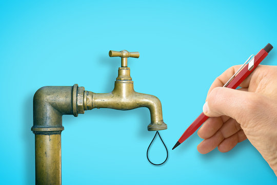 Human hand draws a drop of water against a water brass faucet isolated on solid color background - concept image