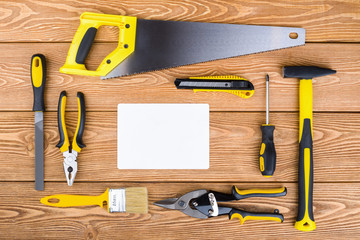 Set of various hand tools on a wooden background 