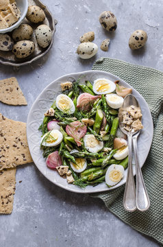 Asparagus and quail egg salad with dried focaccia
