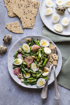 Asparagus and quail egg salad with dried focaccia