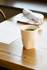 Fototapeta na wymiar Cup of freshly brewed coffee on a restaurant table