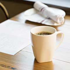Cup of freshly brewed coffee on a restaurant table