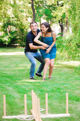 Friends plaing outdoor games - ring toss.