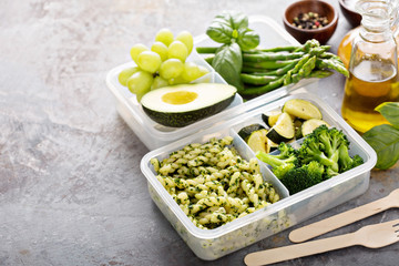 Vegan meal prep containers with pasta and vegetables