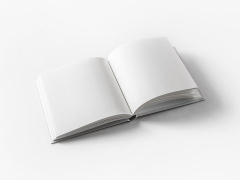 Blank open book on white paper background.