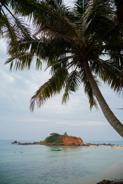 Merissa, Sri Lanka, Parrot Rоck. Huge boulders on the beach.
