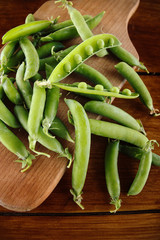 Fresh Green peas. Top view. Pea on wooden background