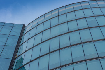 Fototapeta na wymiar Glass facade, modern architecture with blue sky, morning shoot