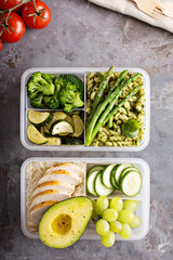 Green and healthy meal prep containers with chicken and vegetables