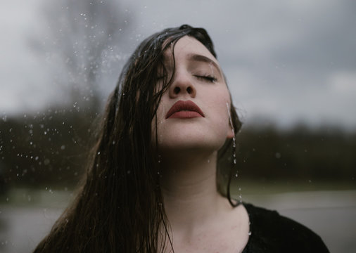 Young Woman Out In The Rain with Soaking Wet Hair