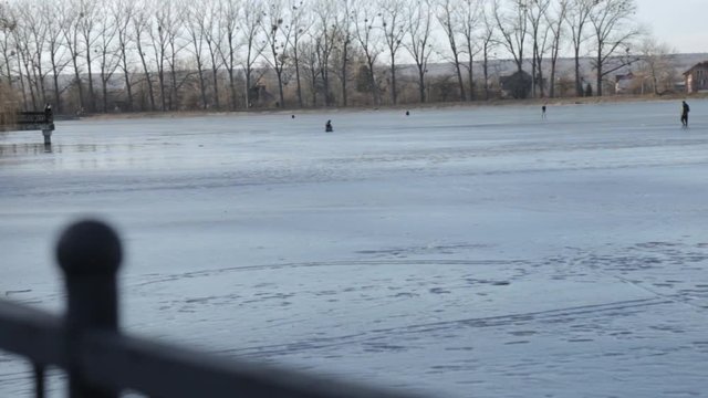 Lonesome man walking on frozen lake