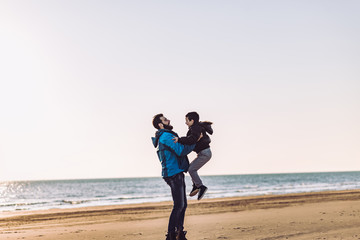 Father and son have fun on beach