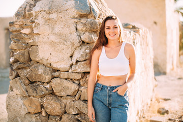 Portrait of an attractive young woman in a desert. Lifestyle concept