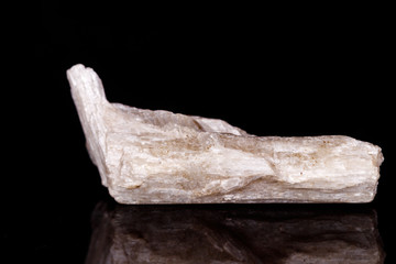Macro mineral stone Orthoclase on black background