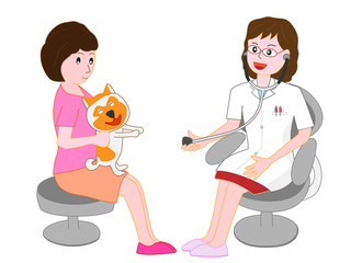 女性獣医師から治療を受けているペットの犬