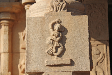 Stone bas-reliefs on the walls in Temples Hampi. Carving stone ancient background. Carved figures...