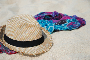Beach summer accessories on sandy tropical beach. 