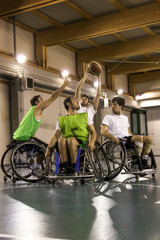 Fototapeta na wymiar disabled sport men in action while playing basketball