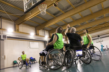 Obraz na płótnie Canvas disabled sport men in action while playing basketball