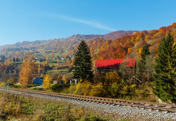 Autumn Carpathian mountains, village and railroad, Ukraine