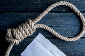 Fototapeta premium Hangman noose with letter of suicide