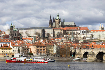 Early Spring Prague gothic Castle with the Lesser Town above River Vltava in the sunny Day, Czech...