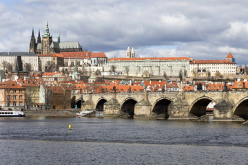 Obraz premium Early Spring Prague gothic Castle with the Lesser Town above River Vltava in the sunny Day, Czech Republic
