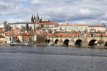 Obraz premium Early Spring Prague gothic Castle with the Lesser Town above River Vltava in the sunny Day, Czech Republic