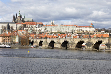 Obraz premium Early Spring Prague gothic Castle with the Lesser Town above River Vltava in the sunny Day, Czech Republic