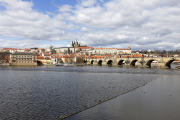 Early Spring Prague gothic Castle with the Lesser Town above River Vltava in the sunny Day, Czech...