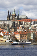 Early Spring Prague gothic Castle with the Lesser Town above River Vltava in the sunny Day, Czech Republic