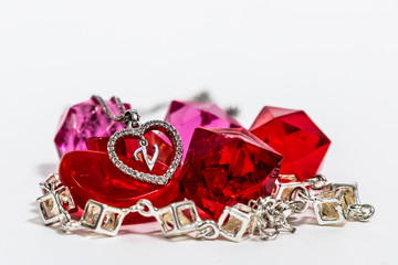 jewelry on white background with hearts