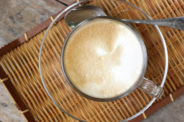 hot coffee cup on wooden table