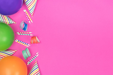 Birthday party composition on pink background. Top view with copy space.