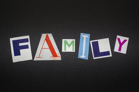 letters cut out from newspapers and magazines that form the word "family", on a black background