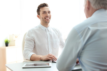 Human resources manager conducting job interview with applicant in office