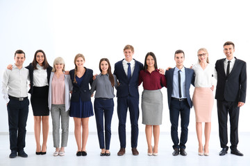 Obraz premium People standing together on light background. Unity concept
