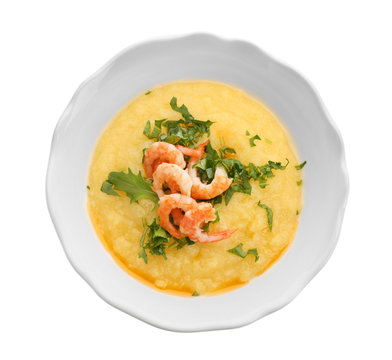 Plate with fresh tasty shrimp and grits on white background