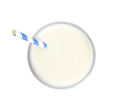 Glass of milk with straw on white background, top view