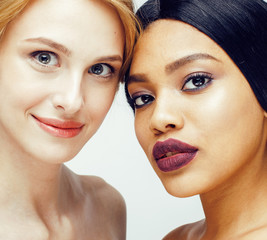 different nation woman: african-american, caucasian together iso