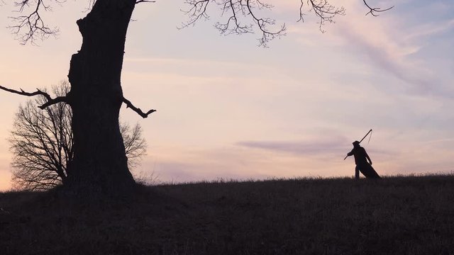 Grim Reaper sunset silhouette. concept of death
