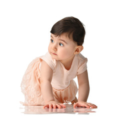 8 month infant child baby girl kid toddler crawling in dress thinking happy laughing isolated