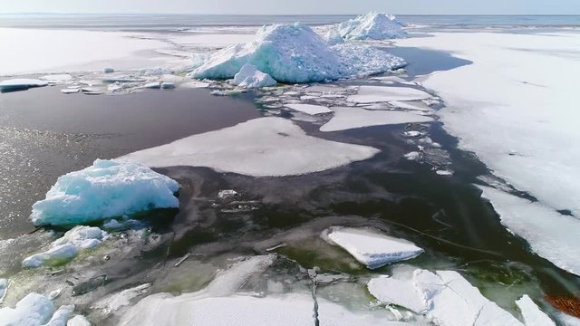 Low flight over ice islands in the Bay of Green Bay, created by high winds, and "ice shoves" in springtime.