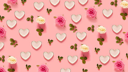 Pink roses and hearts on a pastel pink background
