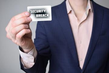 Businessman shows business card with the inscription:SECURITY BREACH