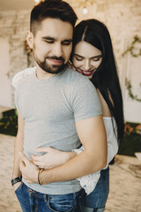 Naklejka premium Sensual adult couple hugging and smiling.