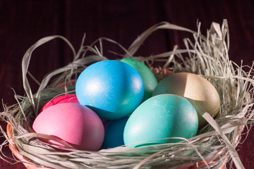 Colorful easter eggs in basket a