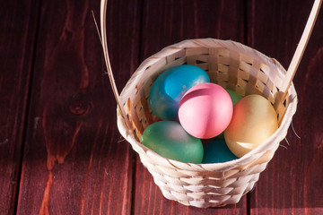 Colorful easter eggs in basket a