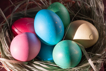 Colorful easter eggs in basket a